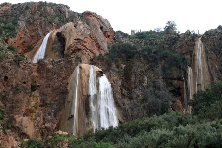 a waterfall on a rocky mountain